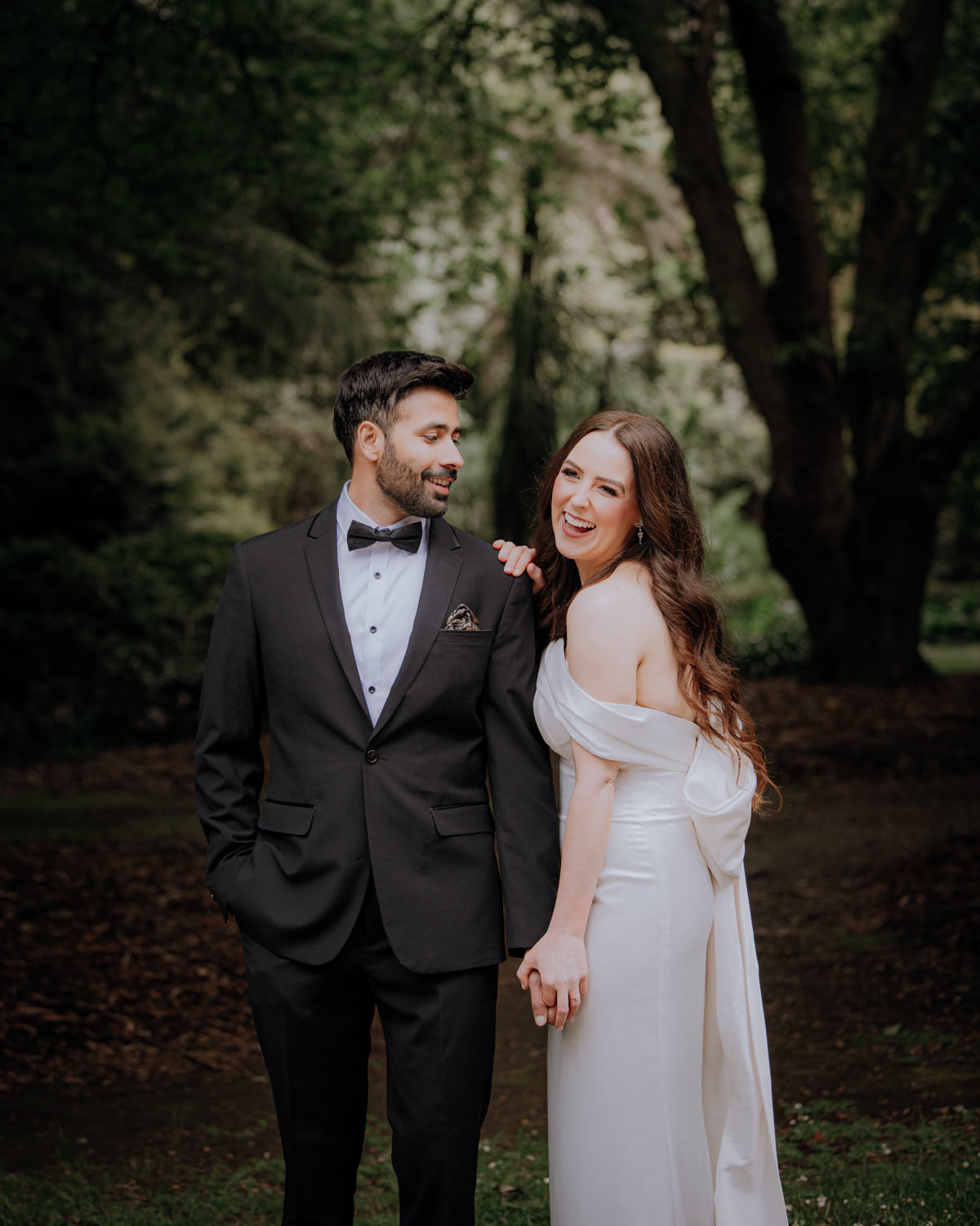 Bride snuggling against her grooms shoulder at their Engagement Session in the Dandenong Ranges